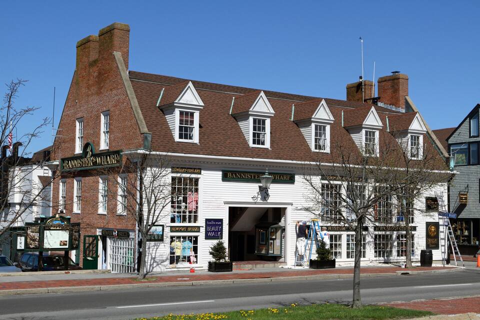 A historic building with a sign that reads "Bannister's Wharf."