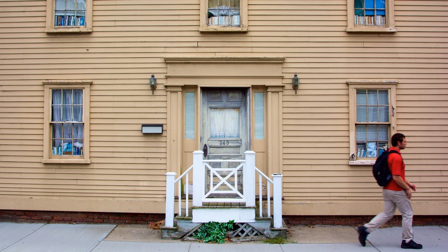 Thames Street featuring a house as well as an individual male