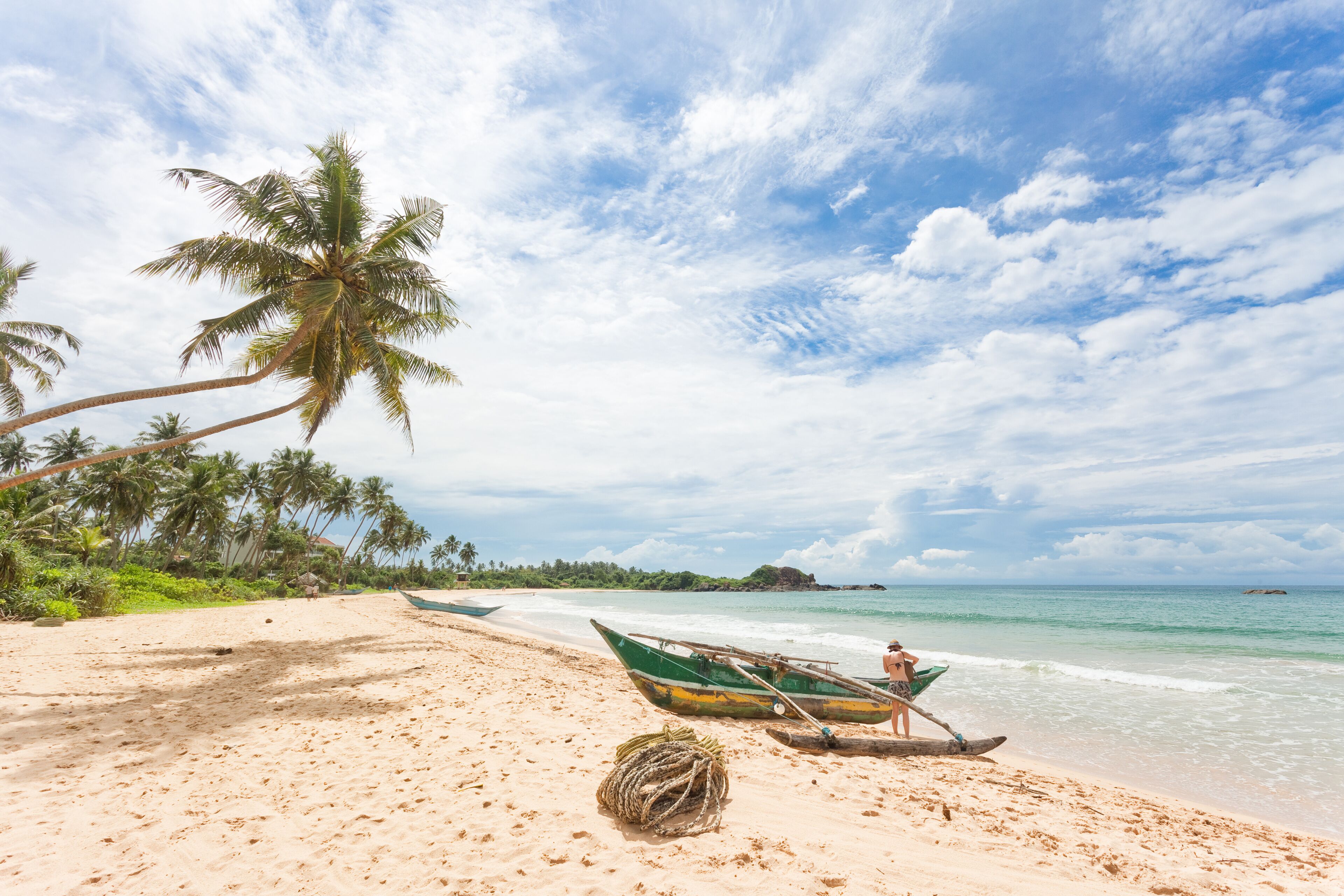 Balapitiya, Sri Lanka - A woman preparing for a canoe tour at the beach of Balapitiya