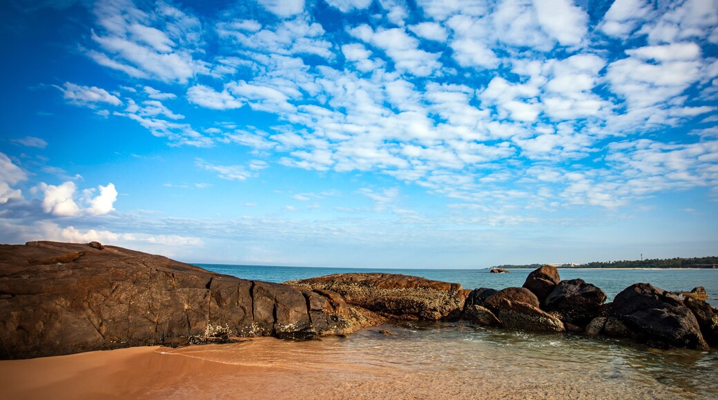 sea and rocks with white clouds in the blue sky of southern Sri Lanka beach.
