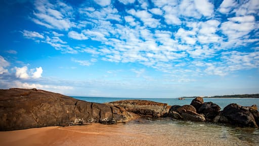 sea and rocks with white clouds in the blue sky of southern Sri Lanka beach.