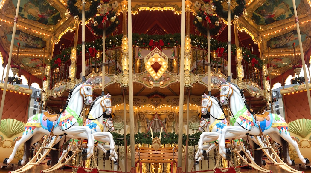 festive merry-go-round carousel with horses and lights in Frankfurt during the Christmas market, Christmas holiday