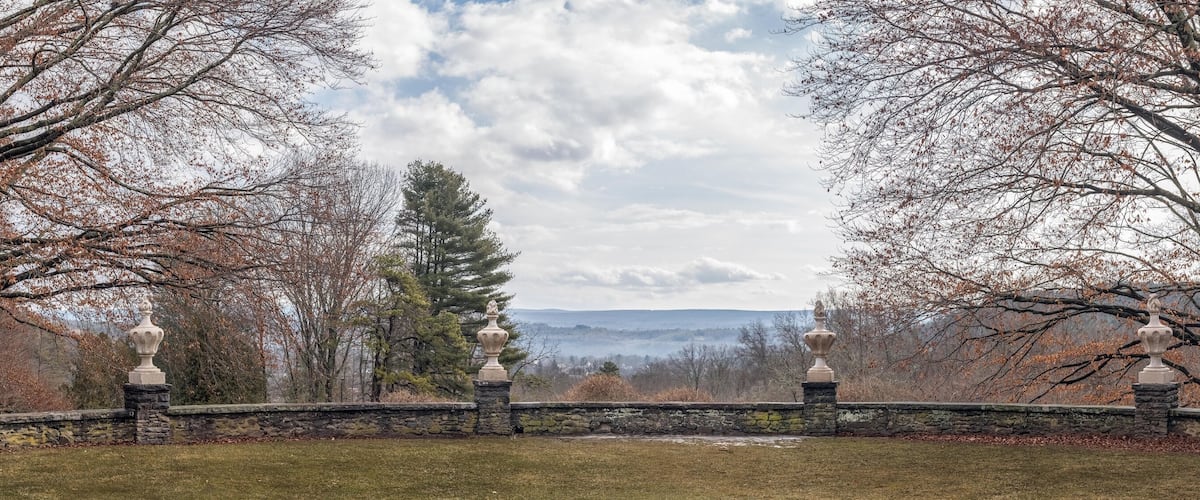 Panoramic view from a landscaped terrace at Grey Towers National Historic Site in Milford, Pennsylvania, looking southwest toward New Jersey on a mild winter day