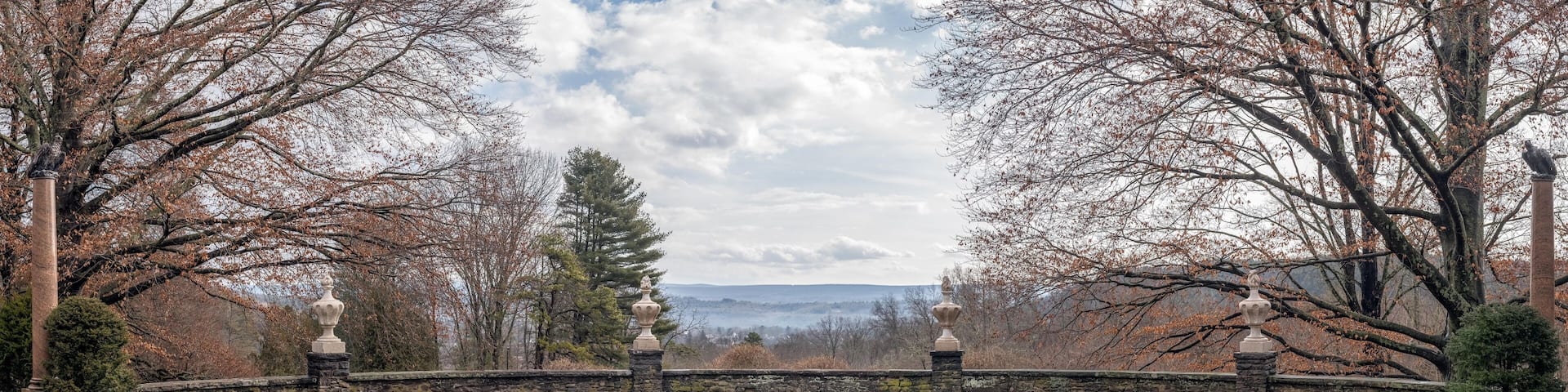 Panoramic view from a landscaped terrace at Grey Towers National Historic Site in Milford, Pennsylvania, looking southwest toward New Jersey on a mild winter day