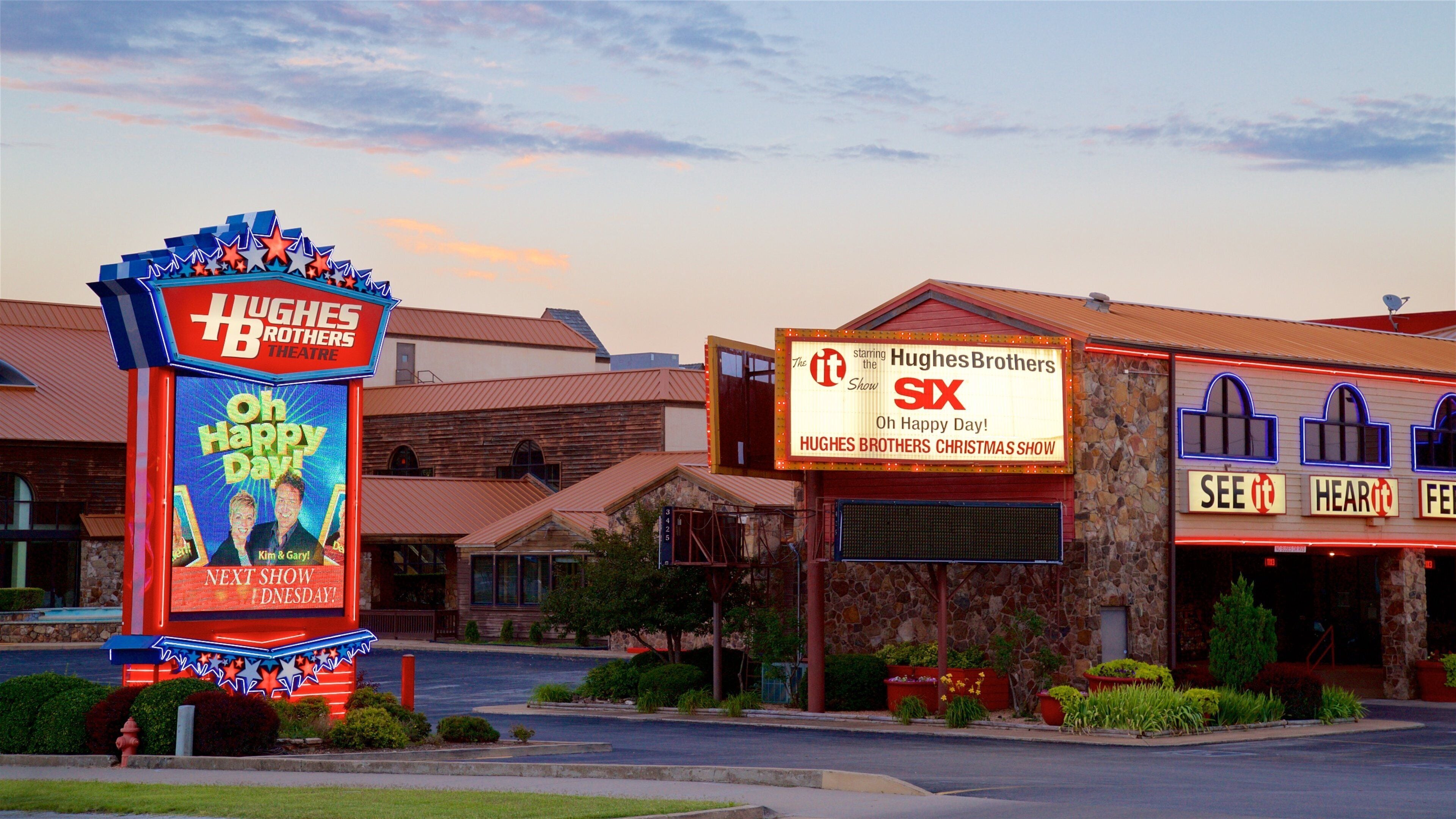 Hughes Brothers Theatre showing a sunset and signage