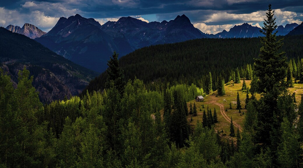 Fall is coming and the storms on the mountains of the San Juans are just beginning. A favorite location is this old cabin caught between rainstorms, behind are the Twightlight peaks on the right and the Vestal Range on the left.