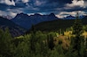 Fall is coming and the storms on the mountains of the San Juans are just beginning. A favorite location is this old cabin caught between rainstorms, behind are the Twightlight peaks on the right and the Vestal Range on the left.