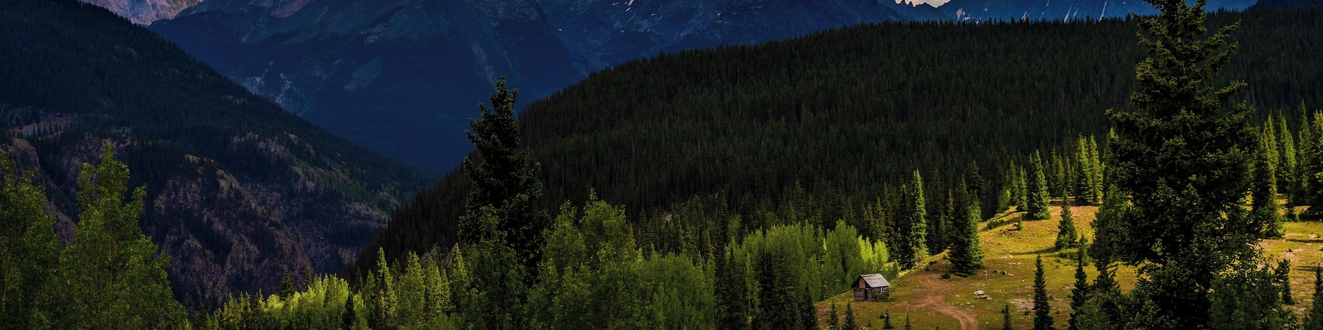 Fall is coming and the storms on the mountains of the San Juans are just beginning. A favorite location is this old cabin caught between rainstorms, behind are the Twightlight peaks on the right and the Vestal Range on the left.