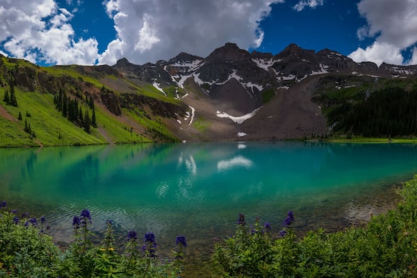 Hiker looks at Blue Lake Ridgway Colorado