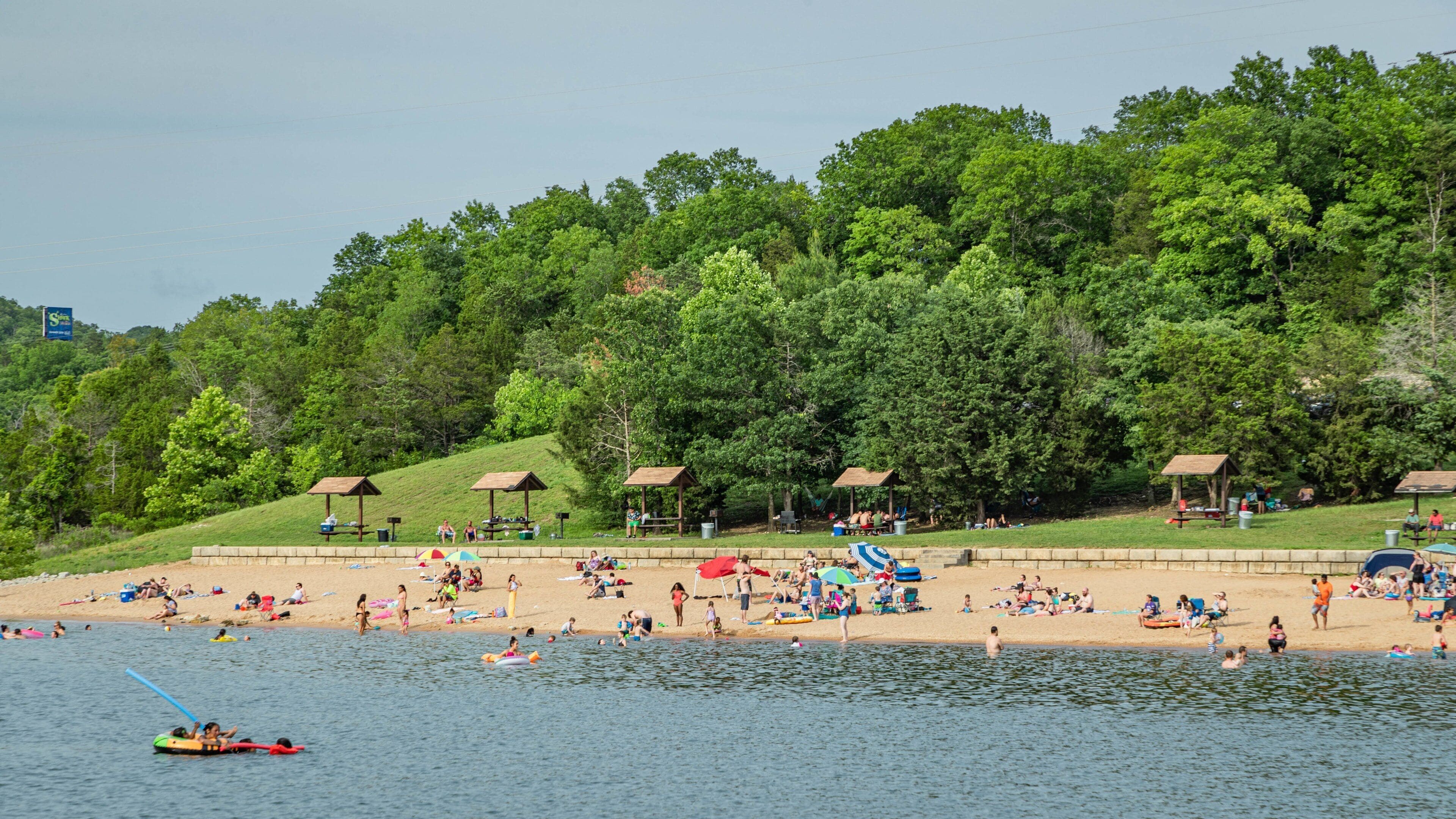 Moonshine Beach which includes general coastal views, a beach and swimming