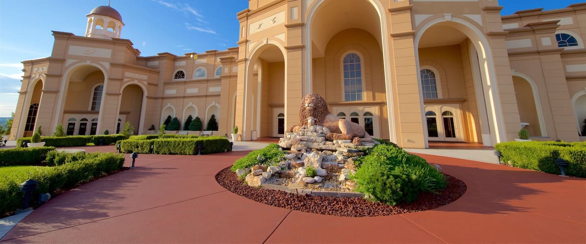 Sight and Sound Theatres showing outdoor art, a fountain and a park