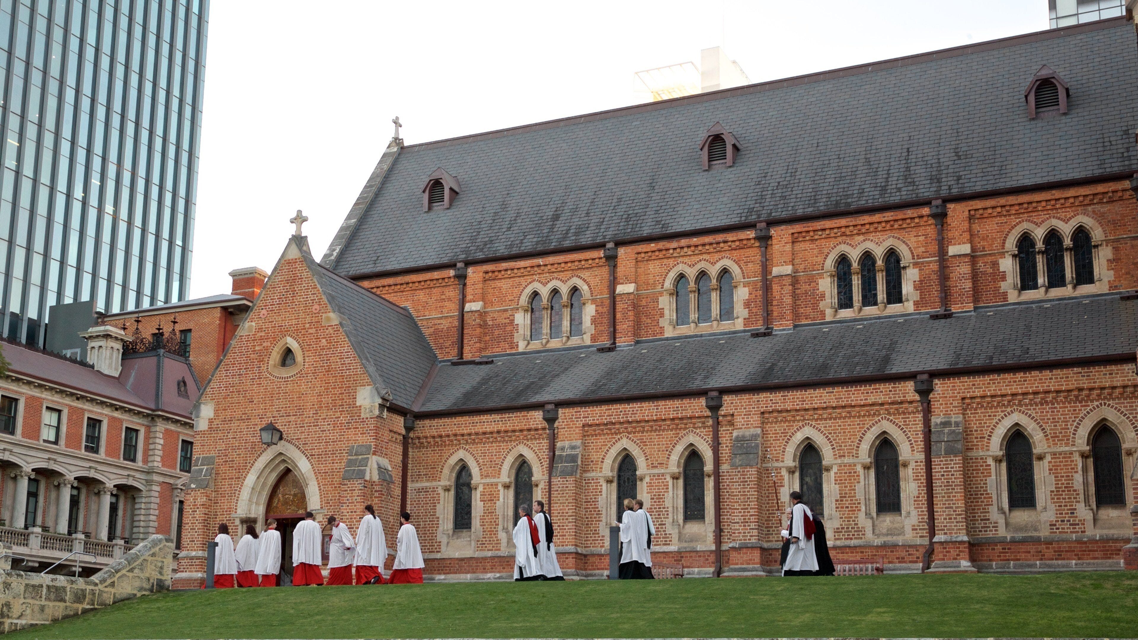 St. George\'s Cathedral which includes heritage architecture and a church or cathedral as well as a small group of people