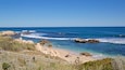 Trigg Beach which includes rugged coastline, landscape views and general coastal views