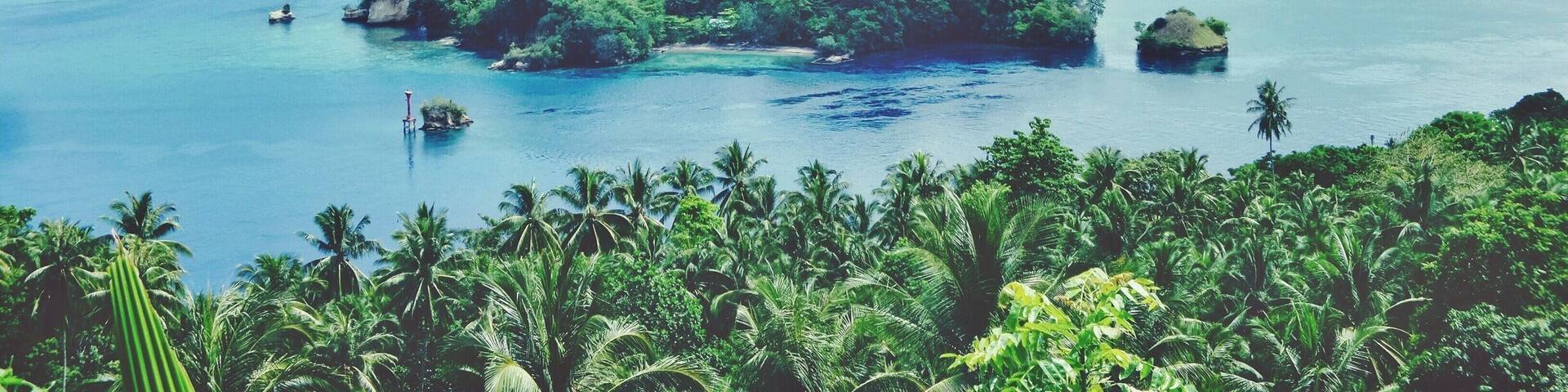 - Lembeh Straits -
This strait is so beautiful. Lots of tiny islands, cliffs, beautiful view and of course beautiful and unique marine ecology.
There are few beautiful resorts that will provide you with nice accommodation, such as BlackSands Retreat, Dabirahe @ Lembeh Hills and Kungkungan Bay resort.
These resorts will help you to explore the beautiful underwater world of Lembeh Strait.
Getting here is very easy as it's connected by road from the capital of North Sulawesi, Manado. It's about one and a half hour ride from Manado to here.