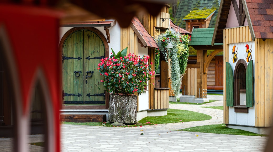 gnome village in attraction park, tiny dwarf houses with colorful facades, fairy tale village