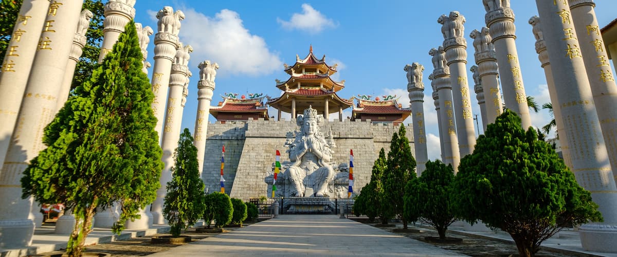 A temple with ornate columns and a traditional pagoda-style roof.