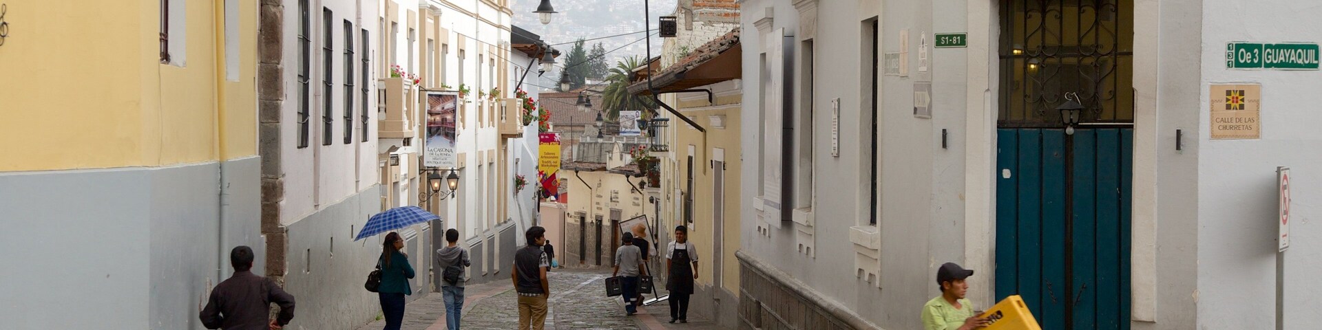 Calle La Ronda featuring street scenes as well as a large group of people