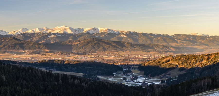 Panorama of Spierlberg-city in Austria with Red Bull Ring race circuit with Alps covered with snow in background.