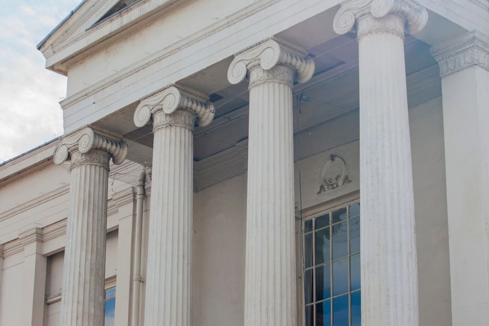 A classical building with large columns and a pediment.