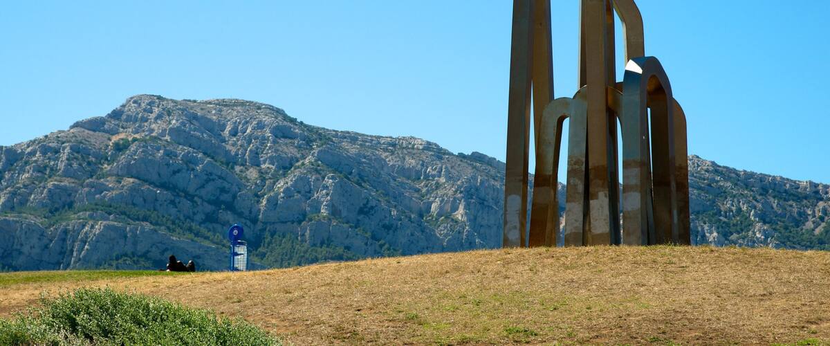 Borely Beach featuring a monument, outdoor art and a garden