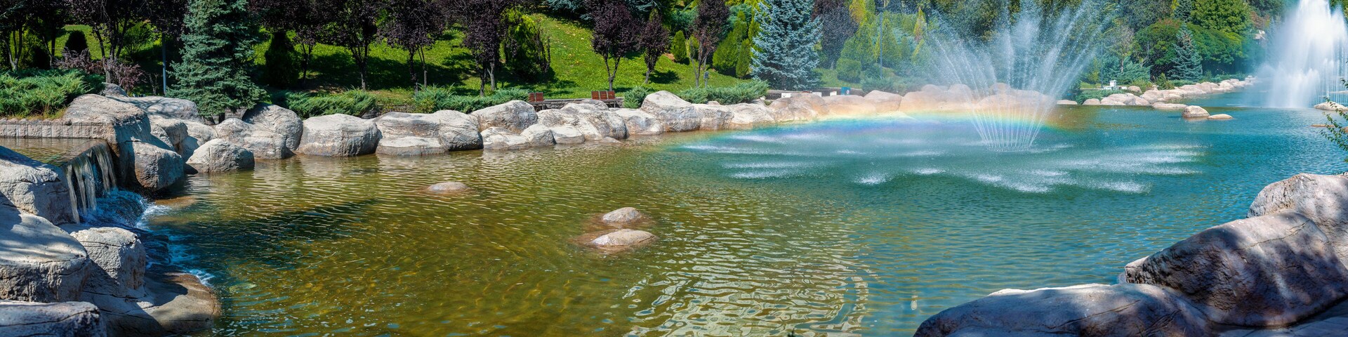 Beautiful panoramic view of Dikmen Valley Park | Dikmen Vadisi Parki in Ankara, Turkey. Thousands of trees, decorative waterfall, rocks, water fountains in the big ornamental pool.