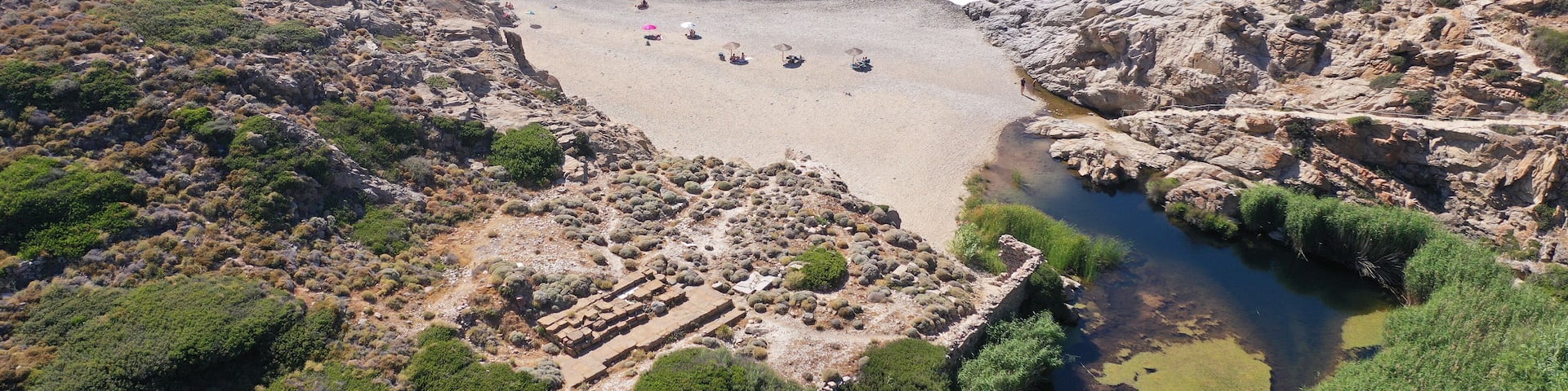 Aerial drone photo of famous bay and sandy wavy beach of Nas with beautiful river reaching deep blue sea, Ikaria island, Northeast Aegean, Greece