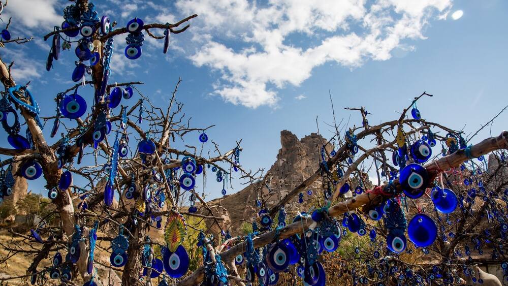 Blue Evil Eye gives peace of mind to Turkish people.. #followme #instagram #turkey #evileye #peaceofmind #peace #tree #sky #cappadocia #ig_cappadocia #natgeo #lonelyplanetturkey #discovery