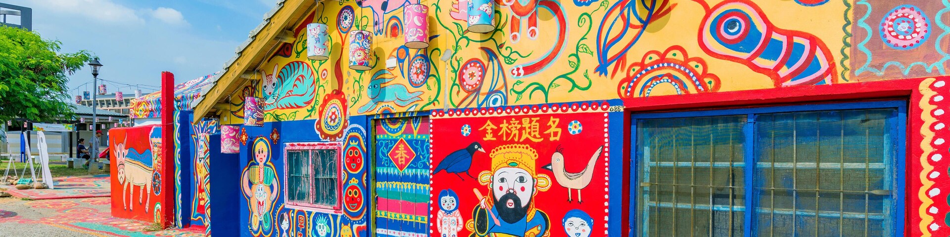 KANJ4D TAICHUNG, TAIWAN - JULY 19: Rainbow village is a popular travel destination where people can view colorful paintings and illustrations on the walls of
