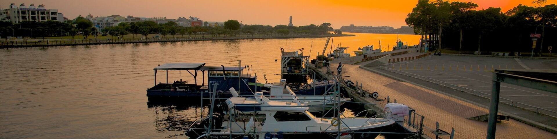 Anping Harbor showing a sunset and a bay or harbor