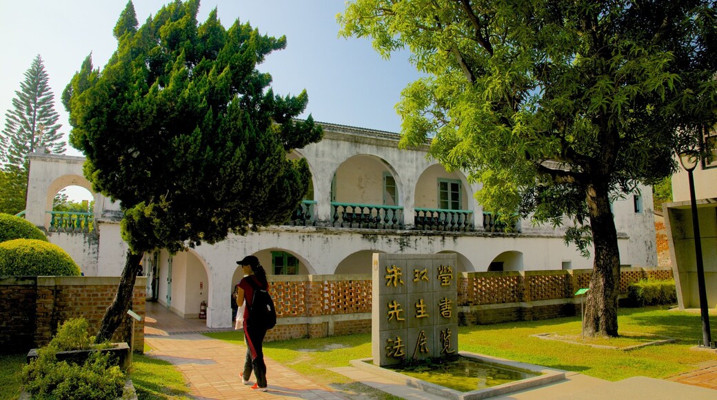 Anping Tree House showing a garden as well as an individual female