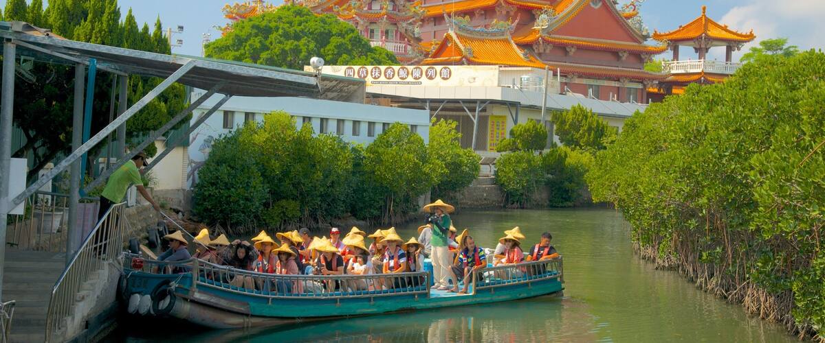 Taijiang National Park which includes a ferry, a river or creek and a temple or place of worship