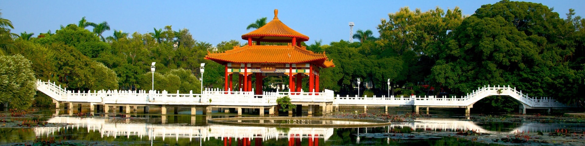 Tainan Park which includes a garden and a lake or waterhole