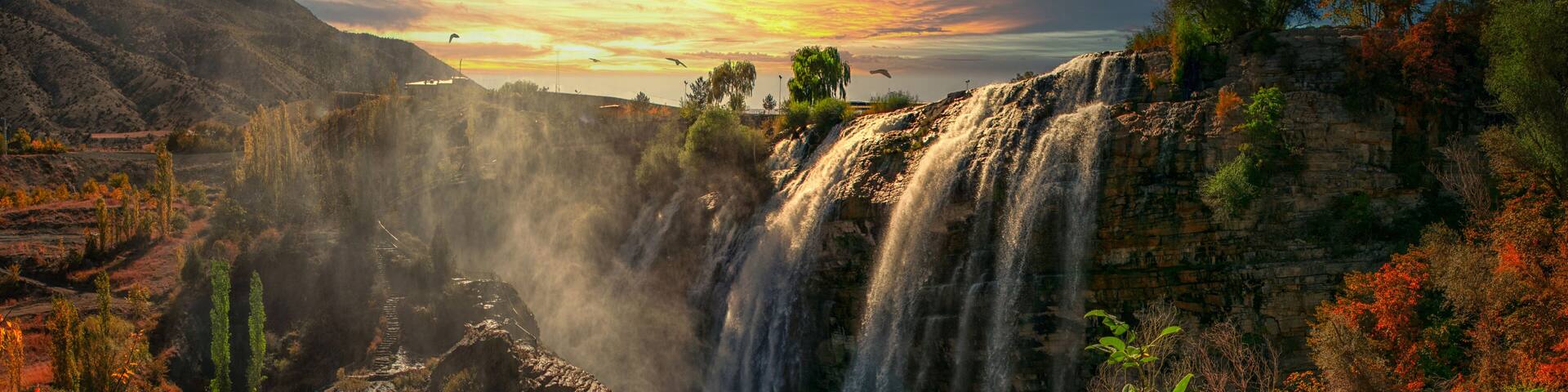 Panoramic image of Tortum (Uzundere) waterfall from down in Uzundere. Landscape view of Tortum Waterfall in Tortum,Erzurum,Turkey. Explore the world's beauty and wildlife.