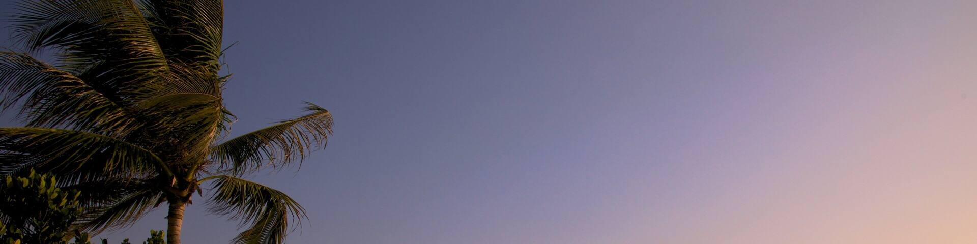 Cijin Seaside Park which includes a sunset and a sandy beach