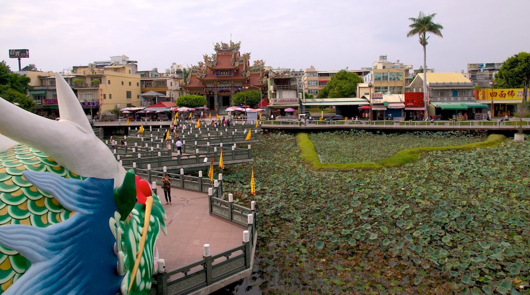 Dragon Tiger Tower featuring a pond
