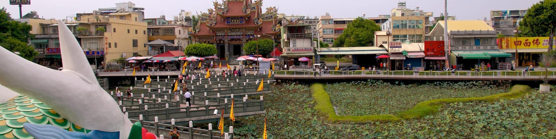 Dragon Tiger Tower featuring a pond