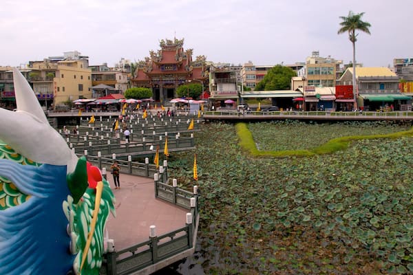Dragon Tiger Tower featuring a pond