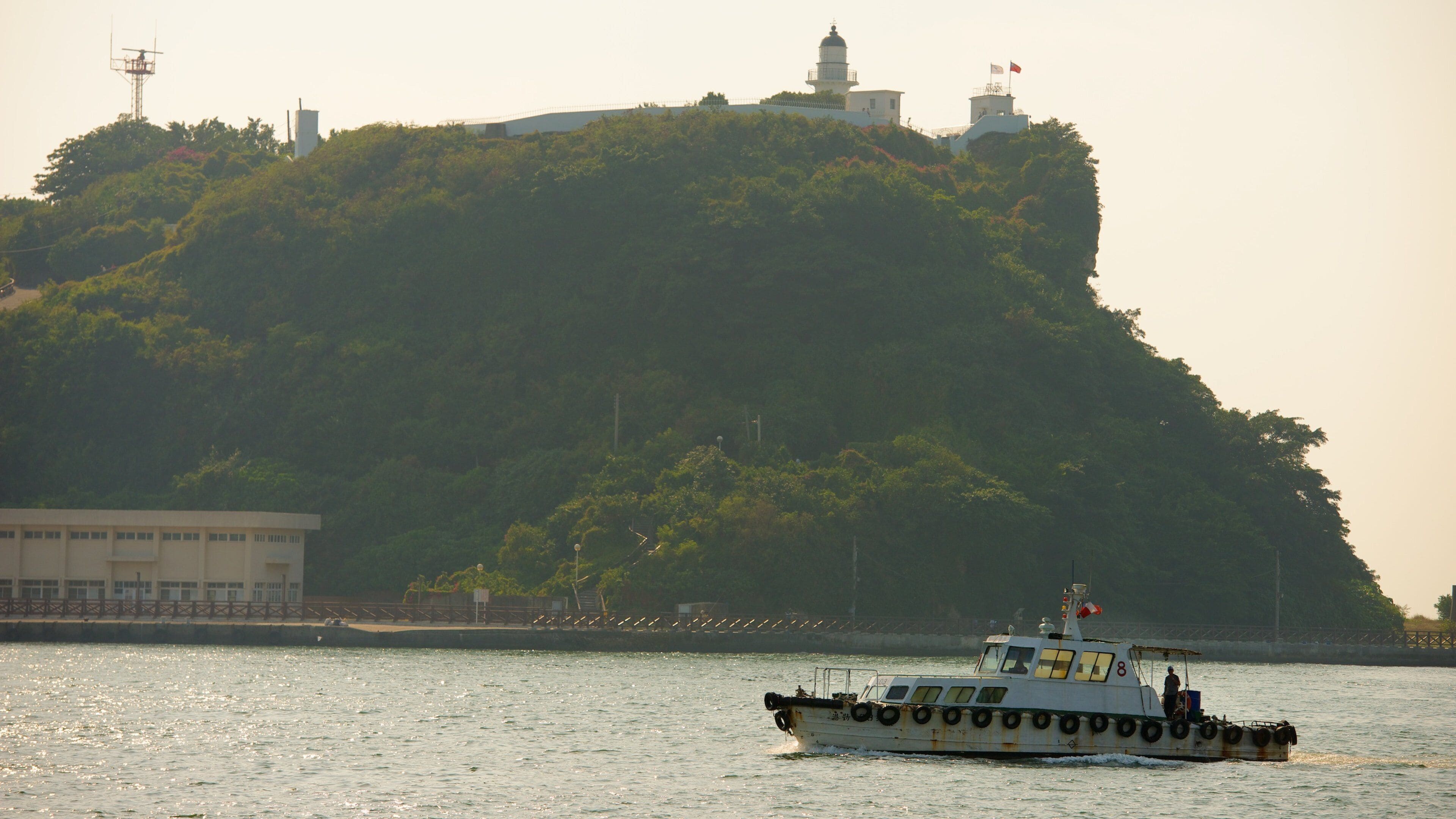Cihou Lighthouse showing tranquil scenes, boating and general coastal views