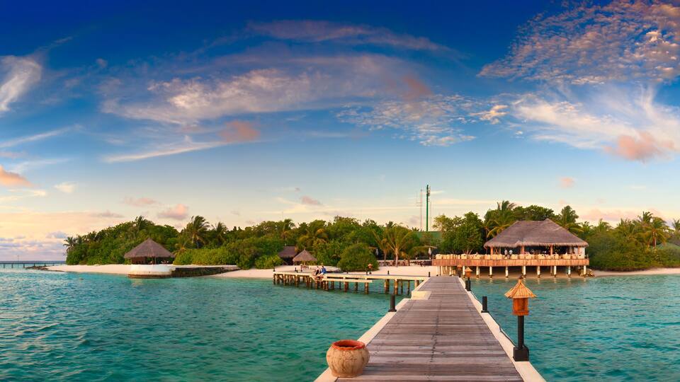 Beautiful sunset over ocean island maldives long panorama