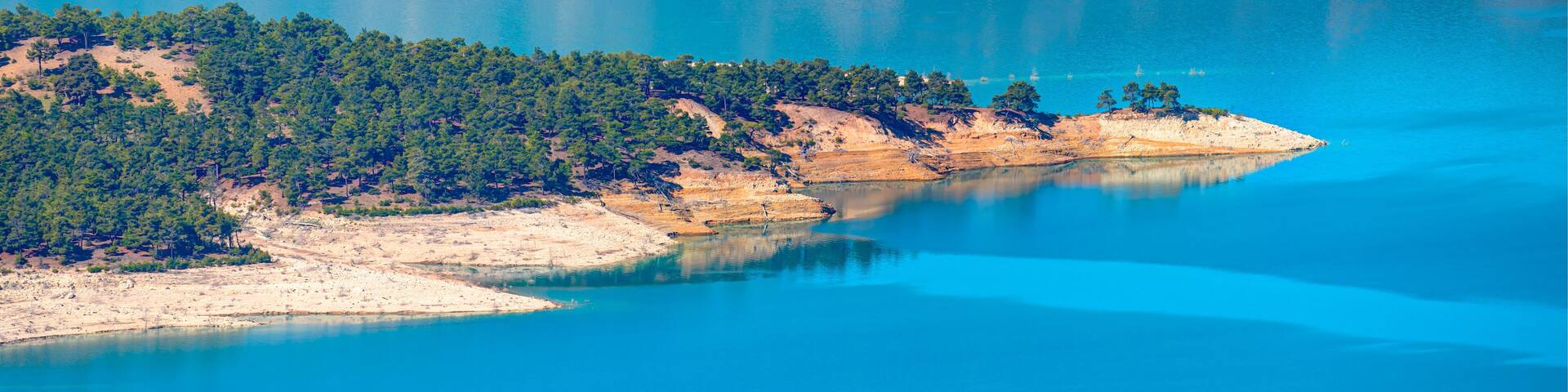 Panoramic view of Ermenek Dam and lake on a sunny day - Konya, Turkey