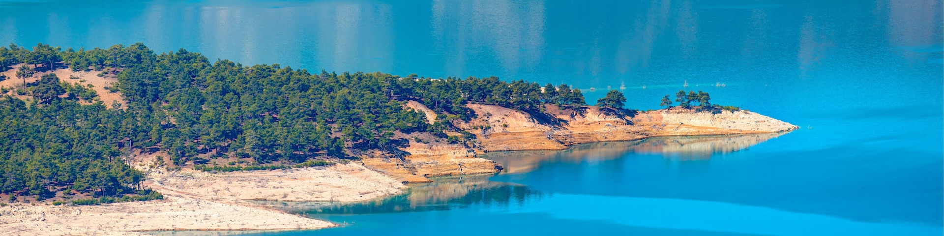 Panoramic view of Ermenek Dam and lake on a sunny day - Konya, Turkey