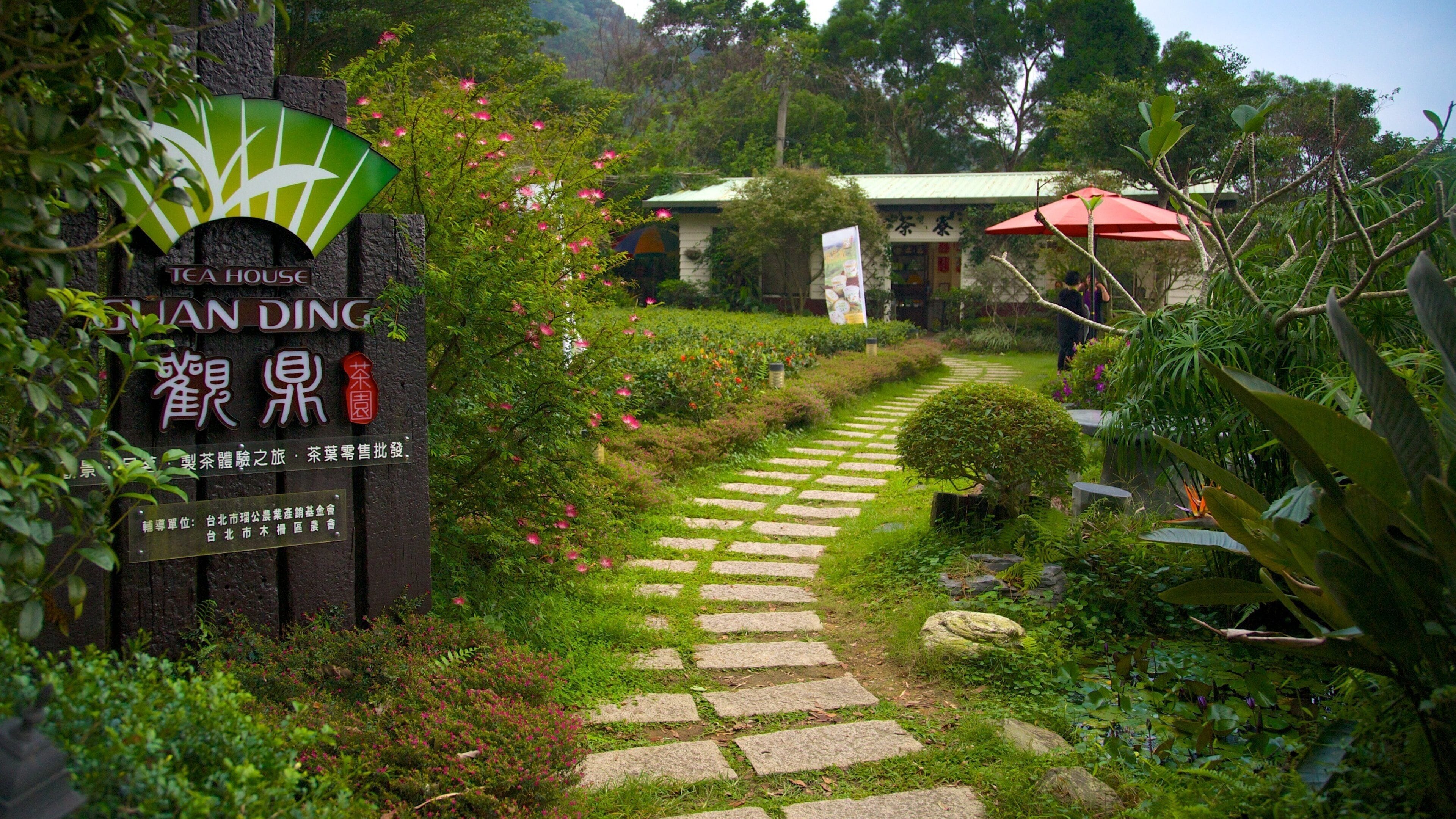 Taipei featuring signage and a park