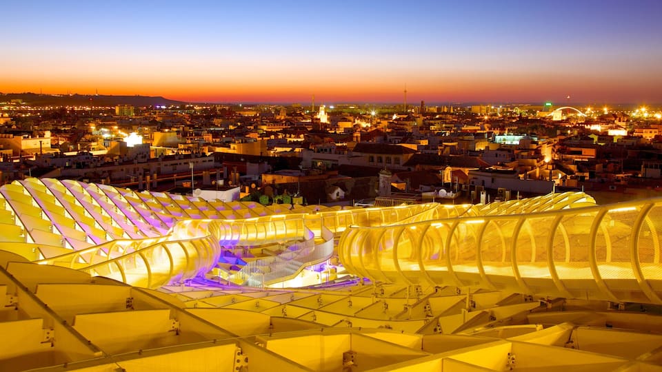 Metropol Parasol showing a sunset, modern architecture and a city