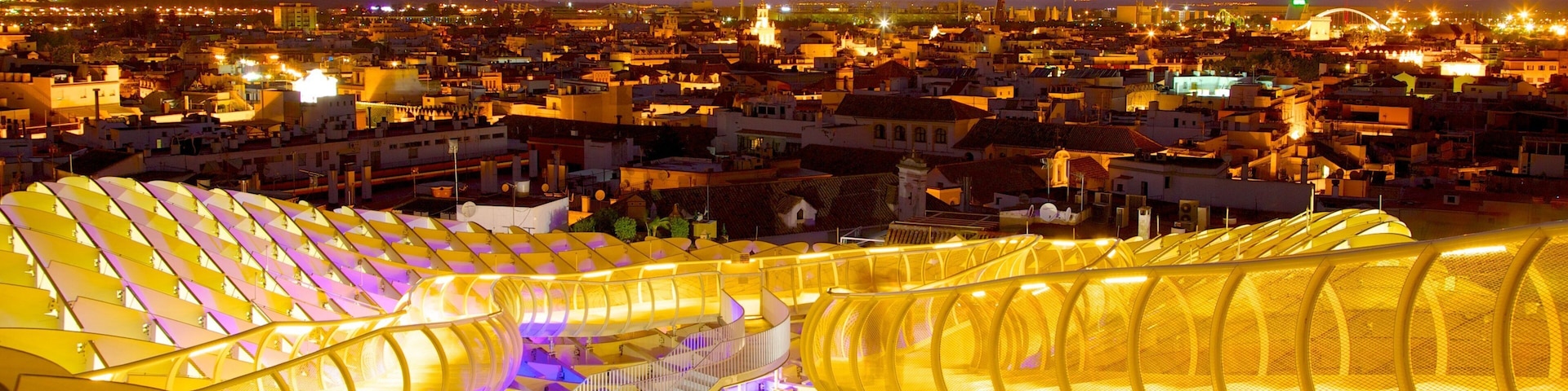 Metropol Parasol showing a sunset, modern architecture and a city