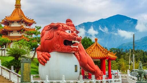 A Chinese Guardian Lion with the ball can be seen at the main entrance outside of Wenwu Temple in Puli County of Taiwan