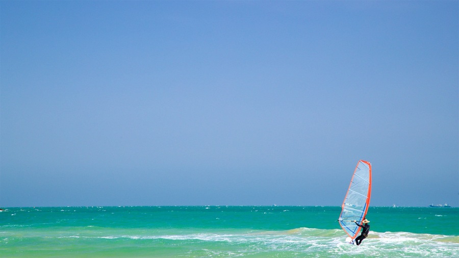 Songjeong Beach showing waves, kite surfing and general coastal views