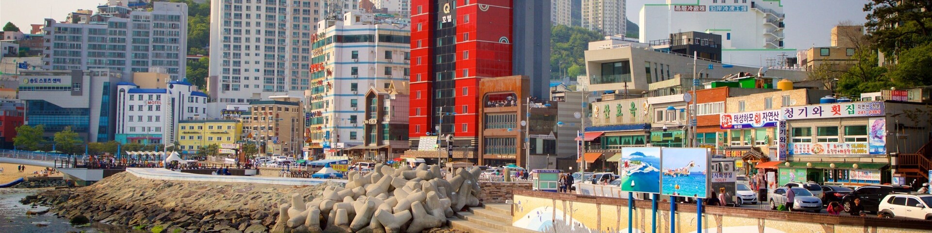 Songdo Beach featuring a coastal town, a city and a sunset