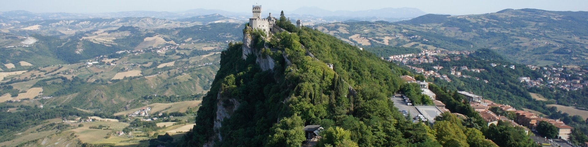 San Marino is beautiful, and should be on everyone's bucket list. It can be seen in a day but it's worth staying overnight as it's much quieter in the evenings, the towers stay open until 8pm in summer, and the sunsets are magical