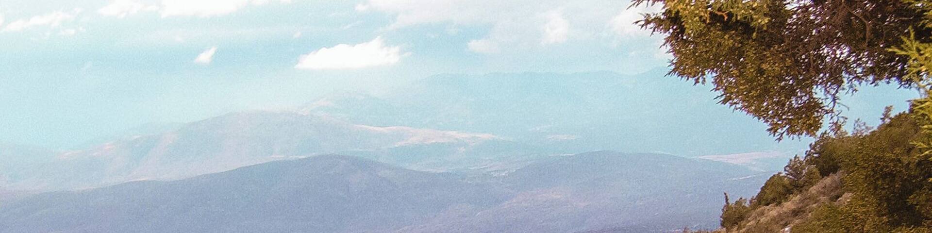 Mount Parnassus is a mountain of limestone in central Greece that towers above Delphi, north of the Gulf of Corinth, and offers scenic views of the surrounding olive groves and countryside.