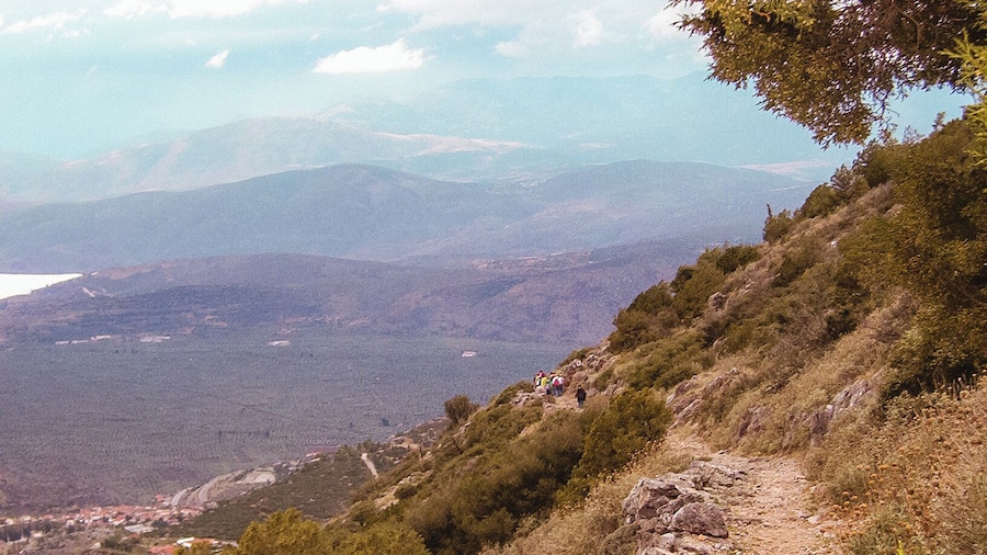 Mount Parnassus is a mountain of limestone in central Greece that towers above Delphi, north of the Gulf of Corinth, and offers scenic views of the surrounding olive groves and countryside.